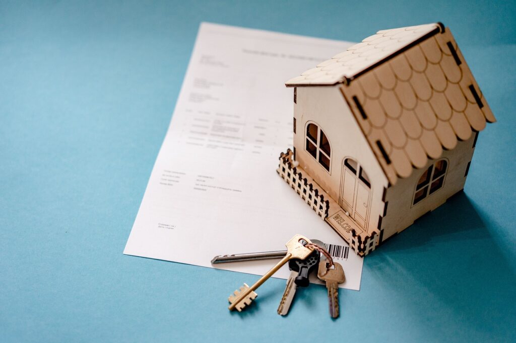 Property title split paperwork with house keys, illustrating the legal process for dividing property ownership.