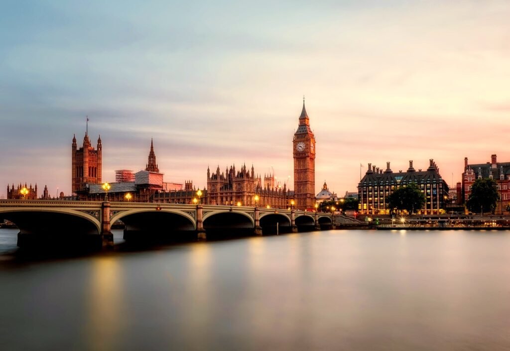 A scenic view of the UK Parliament and Big Ben at sunset, representing government reforms connected to UK settlement changes.